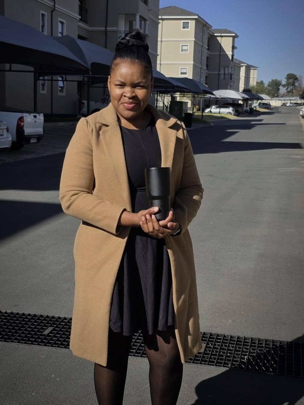 Bonniee, founder and creative director, in a camel coat.